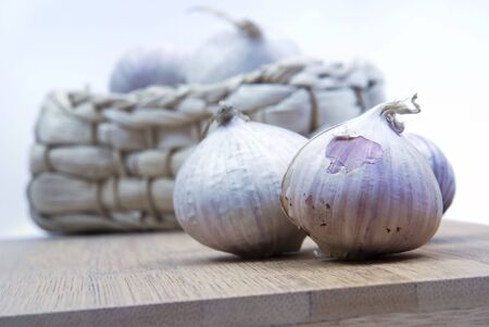 Garlic on a kitchen boardの写真素材