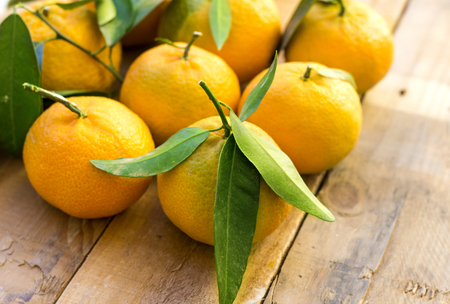 fresh arabic groupe of mandarin fruits on wood tableの写真素材