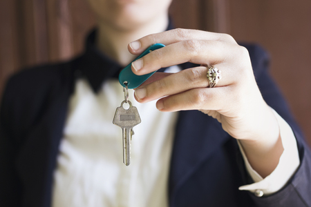 Young business woman Holding Keyの写真素材