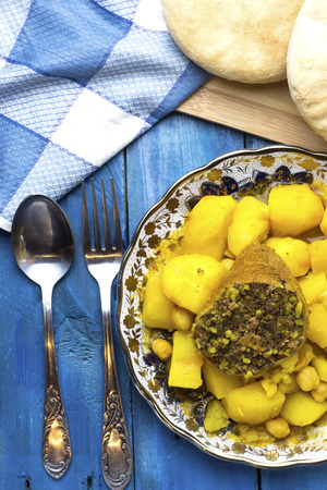 Algerian food tajine potato with chickpeas and meat of sheep with Arabic homemade breadの写真素材