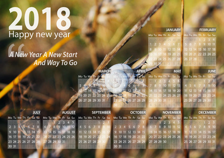 calendar 2018 happy new year with snail above the branch backgroundの写真素材