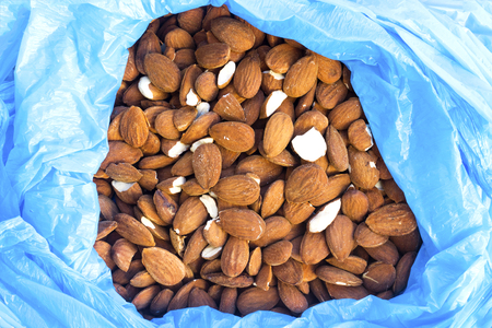 almond background on plastic bagの写真素材