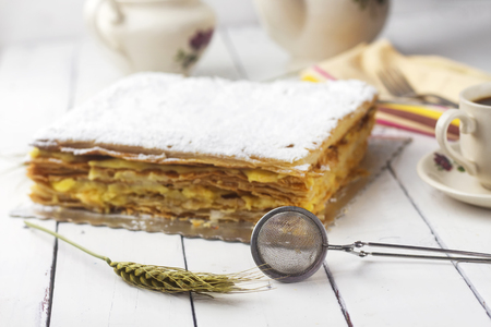 homemade delicious french sugar powder mille-feuille cake with arabic coffee milkの写真素材