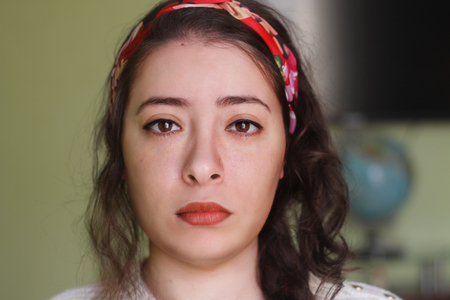 beautiful sad arabic woman looking to cameraの写真素材