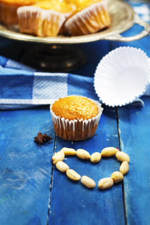 homemade arabic sugar muffins and heart shape peanutsの写真素材