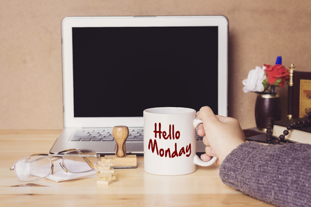 muslim woman drinking a coffee and hello monday conceptの写真素材