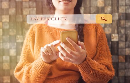woman with beautiful smile and a braid hair and browsing pay per click in the search barsの写真素材