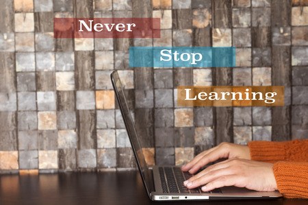 business hand women using a laptop and never stop learning concept