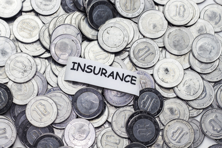 save money concept,tag insurance above algeria coinの写真素材