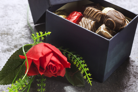 various chocolate in  gift box with  red flower  for valentine's dayの写真素材