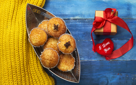 homemade delicious arabic muffins on boat shape with present for holiday conceptの写真素材
