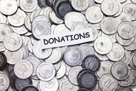 save money concept,tag donations  above algeria coinの写真素材
