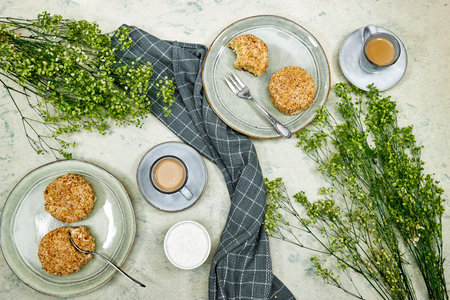 homemade vanilla cream cake on black plate with coffee cupの写真素材