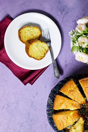 delicious coconut bundt cake delicious coconut bundt cake and flowers pot on grunge purple...