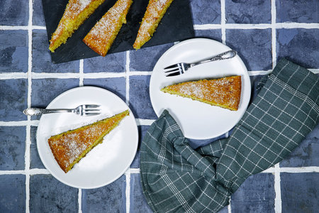 Middle eastern semolina cake basbousa , namoora, hareesa with coconut on tile background