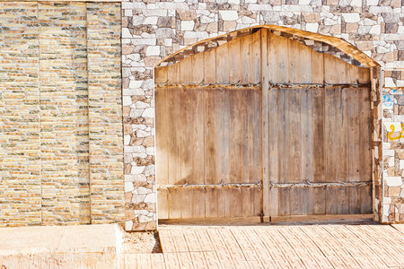 Carved Entrance arch Door on old stones facade