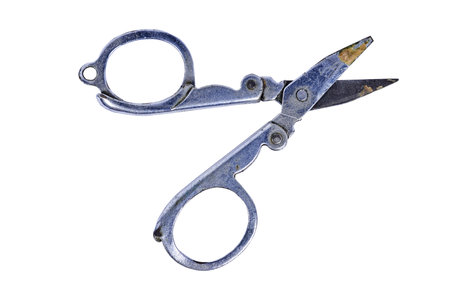 Vintage metal scissors open isolated on white, An isolated shot of open, vintage metal scissors with...