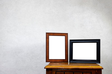 two Empty ornate picture frame on  wood tableの写真素材