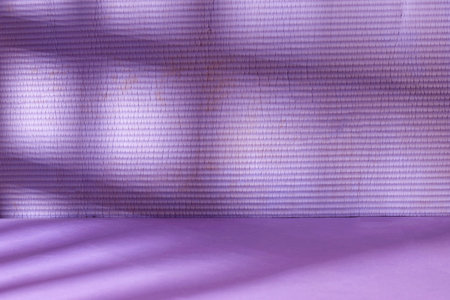 Shadows and light patterns on a grunge wall mockup. Empty roomの写真素材