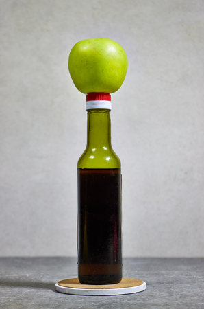 Apple cider or juice drink and green apple. Garden organic green apple and fermented drinkの写真素材