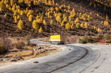 Autumn view of mountain road in Shangri-la,Daocheng,sichuan,China.の写真素材