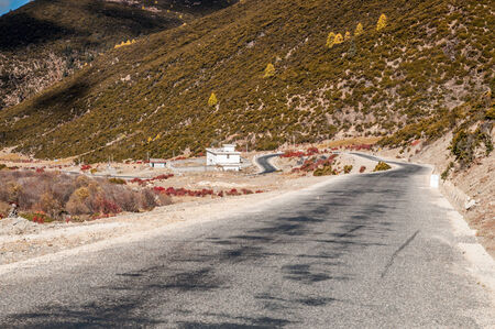 Autumn view of mountain road in Shangri-la,Daocheng,sichuan,China.の写真素材