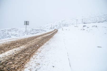 High mountain road with snow in Deqin,Yunan,China.の写真素材