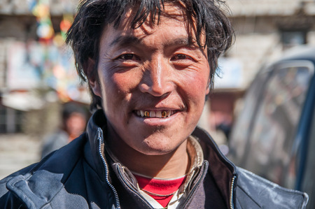 Daocheng, Sichuan,China - October 20,2008 :  An unidentified tibetan  Chinese man at the country town of Daocheng, Sichuan Province, China.Tibetan people are an ethnic group native to Tibet.のeditorial素材
