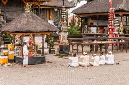 Bali, Indonesia, April 21,2010 : Balinese people sit down to pray at Pura Luhur Batukaru Temple in Bali,Indonesia.のeditorial素材