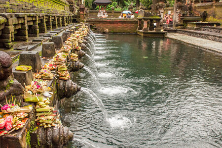 Bali, Indonesia, April 21,2010 : Balinese people at holy spring water temple Pura Tirtha Empul during purification ceremony  in Tampak Siring, Bali, Indonesia.のeditorial素材