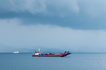Bali, Indonesia, April 23,2010 : Ferry from Java to Bali under the storm in Bali,Indonesia.のeditorial素材