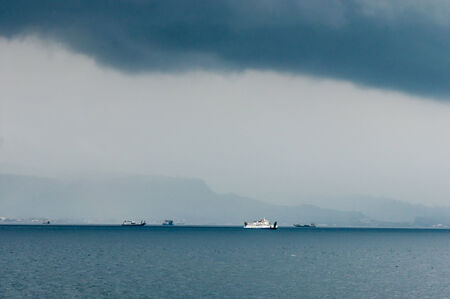 Bali, Indonesia, April 23,2010 : Ferry from Java to Bali under the storm in Bali,Indonesia.のeditorial素材