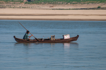 Bagan,Myanmar-March 17,2011 : Unidentified Myanmar people and  boat transporting across  the Irrawaddy river in Bagan,Myanmar.のeditorial素材