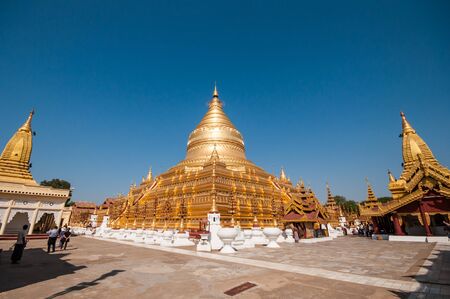 Bagan,Myanmar-March 18,2011: The tourists visiting Shwezigon Paya (pagoda) in Bagan, Myanmar.  It was first built by King Anaweahta then completed by Kyansittha (1084-1113).のeditorial素材