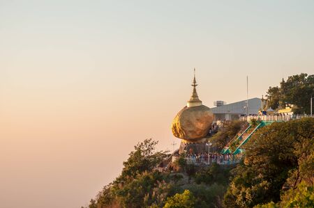 Kyaiktiyo,Myanmar-March 22,2011: Myanmar People praying and used gold leaf to pay homage and worship at Kyaikhtiyo pagoda,That sits atop Mount Kyaiktiyo is one of the most sacred sites  in Kyaikhtiyo of Mon state in Myanmar.のeditorial素材