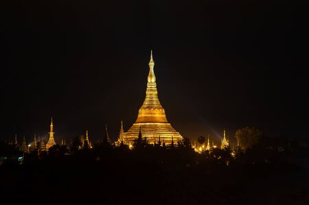 Shwedagon Pagoda at night in Yangon Myanmarの写真素材