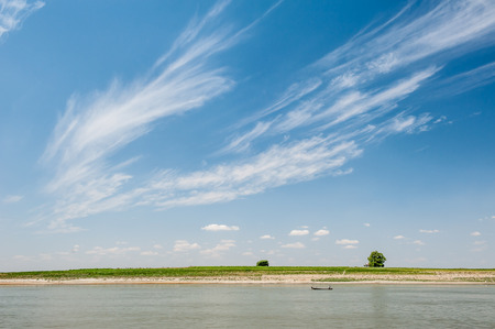 River  landscape with clouds and blue sky in summerの写真素材