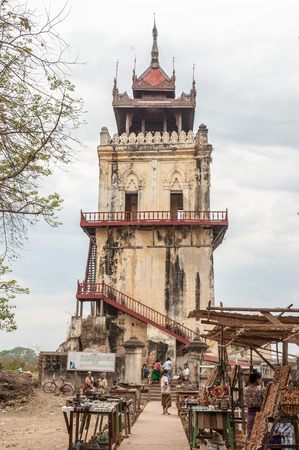 InwaMyanmarMarch 162011 : Tourist visit Nanmyint watch tower one of the famous travel destinationbuilt in 1822 and 90ft 30m high  in Inwa or Ava ancient city Mandalay Myanmar.のeditorial素材