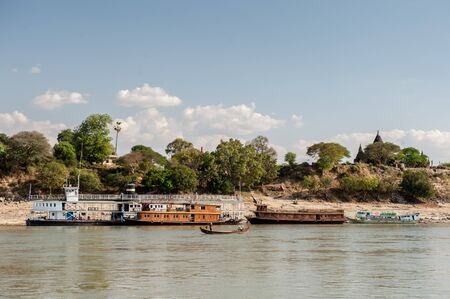 Bagan,Myanmar-March 17,2011 : Lot of transport ships in harbor on the bank of the Irrawaddi river   in  in Bagan, Myanmar.のeditorial素材