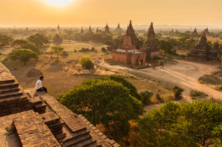 BaganMyanmarMarch 192011 : Unidentify Myanmar man looking  plain of temples of Bagan on sunrise in BaganMyanmar.のeditorial素材