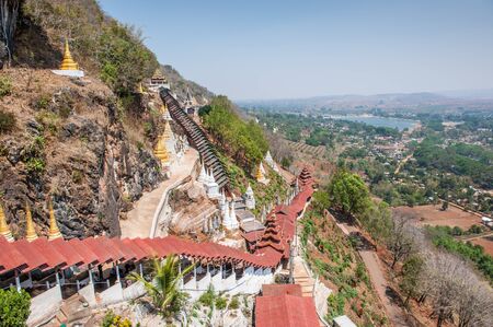 Staircases on the slope of mount witn Pindaya natural caves, Myanmar,located in the hills of the Shan State ,are a Buddhist pilgrimage site and a tourist attraction.のeditorial素材