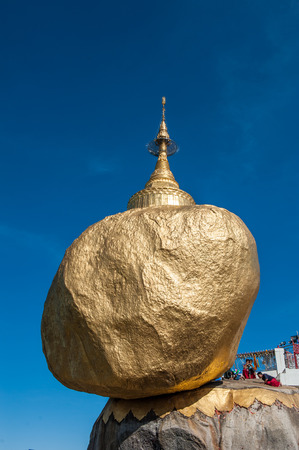 Kyaiktiyo,Myanmar-March 23,2011: Myanmar People  used gold leaf to pay homage and worship at Kyaikhtiyo pagoda,That sits atop Mount Kyaiktiyo is one of the most sacred sites  in Kyaikhtiyo of Mon state in Myanmar.The pagoda is 1100km above sea-level.のeditorial素材