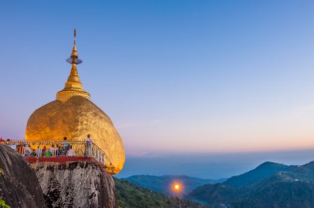 Kyaiktiyo,Myanmar-March 22,2011: Myanmar People praying and used gold leaf to pay homage and worship at Kyaikhtiyo pagoda,That sits atop Mount Kyaiktiyo is one of the most sacred sites  in Kyaikhtiyo of Mon state in Myanmar.The pagoda is 1100km above sea-のeditorial素材