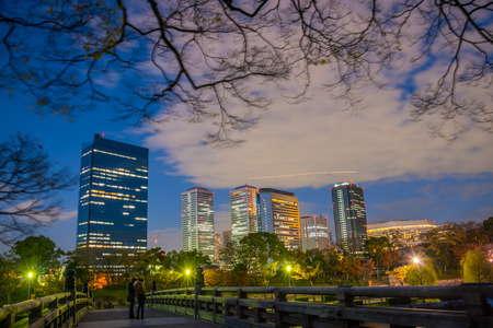 Osaka,Japan - November 28, 2015 : Japan cityscape at Osaka in autumn looking from Osaka castle park in Osaka, Japan.のeditorial素材
