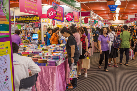 Bangkok, Thailand - March 30, 2015 : Unidentified visitors and children select books in Bangkok book fair festival at Queen Sirikit National Convention Center in Bangkok, Thailand.のeditorial素材