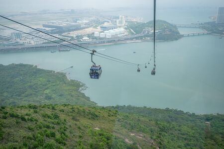 Hong Kong - May 4,2018 : The tourists on Ngong Ping 360 cable car from Tung Chung station to Ngong Ping village on Lantau Island in Hong Kong, the world's most amazing cable car.のeditorial素材