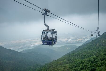 Hong Kong - May 4,2018 : The tourists on Ngong Ping 360 cable car from Tung Chung station to Ngong...