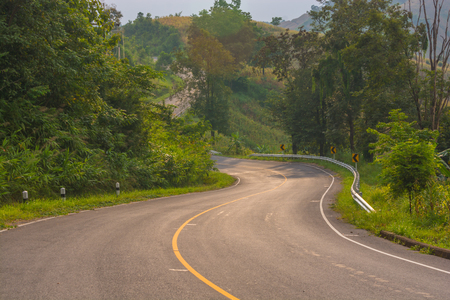 asphalt road in countryside on sunny summer dayの写真素材