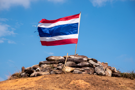 Flag of Thailand. Image of waving Thai flag of Thailand with blue sky and mountainの写真素材