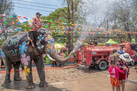 Ayuthaya, Thailand - April 15, 2019 : Elephant and peoples are splashing water in Songkran festival(water festival) in Ayutthaya, Thailand.のeditorial素材